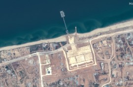 A handout satellite image courtesy of Maxar Technologies shows the US-built Trident Pier on the Gaza coast lined up nearby