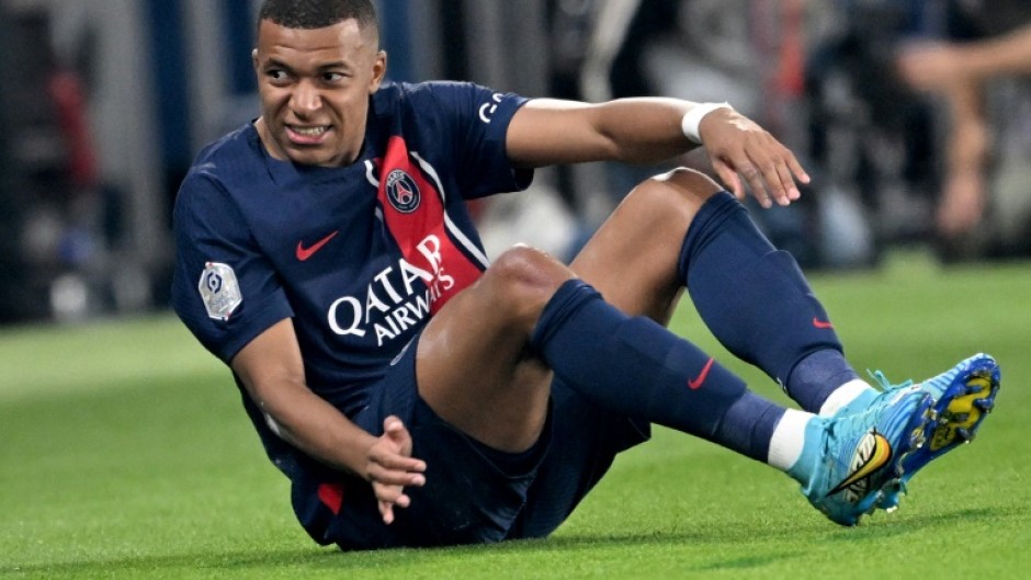 Kylian Mbappe came off in the first half after appearing to hurt his left ankle