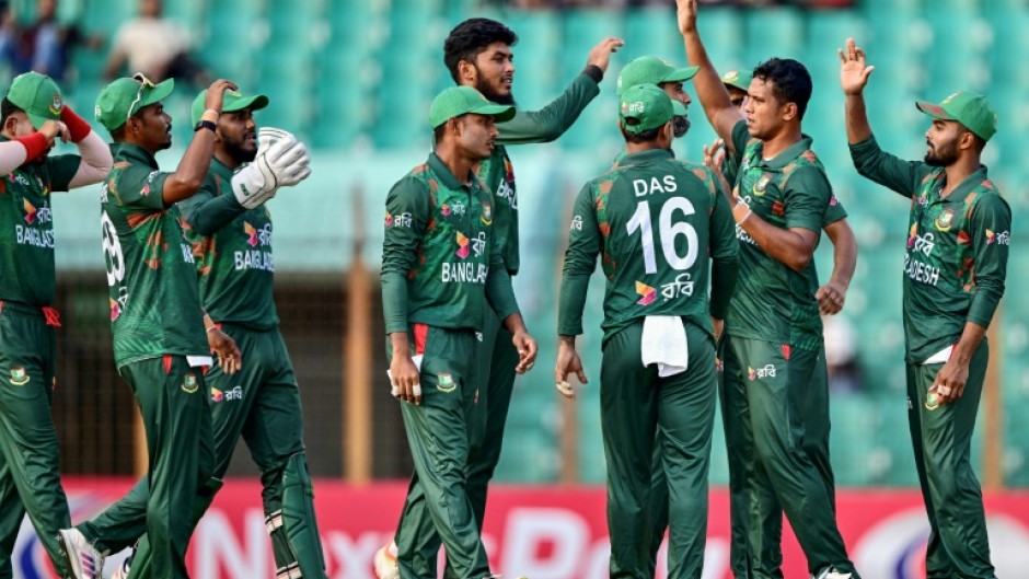Bangladesh players celebrate during the third Twenty20 international cricket match against Zimbabwe in Chittagong