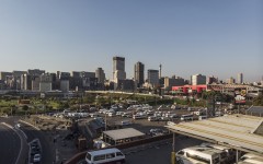 This aerial view shows the Johannesburg skyline and the Bree taxi rank in Newtown, Johannesburg, on May 7, 2020.