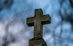 File: Detail of a catholic cross on a grave in the cemetery. Xose Bouzas/Hans Lucas via AFP