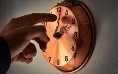 File: A man changing time on a clock. Lorenzo Di Cola/NurPhoto via AFP
