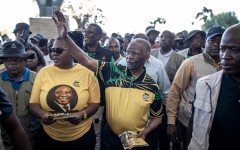 Former president Thabo Mbeki greets supporters as he arrives for an election campaign event. Per-Anders Pettersson/Getty Images
