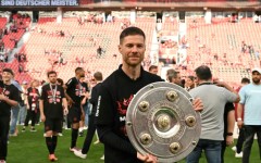 'Outstanding': Bayer Leverkusen coach Xabi Alonso poses with the Bundesliga trophy 