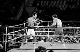 Muhammad Ali (L) reclaiming his world titles from George Foreman in Kinshasa, Zaire, in 1974
