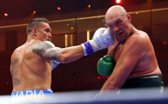 Ukraine's Oleksandr Usyk (L) on the way to a split decision victory over Britain's Tyson Fury for the undisputed heavyweight world title