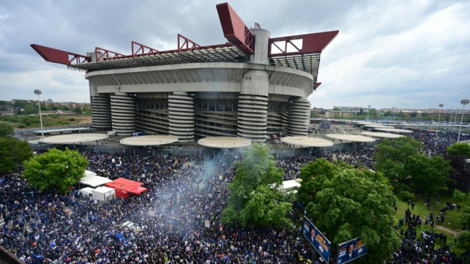 Inter Milan supporters celebrate their team's Serie A title outside the San Siro 