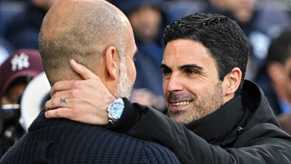 Manchester City manager Pep Guardiola (left) is going head to head with Arsenal's Mikel Arteta for the Premier League title