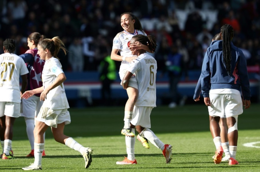 Selma Bacha and Melchie Dumornay, Lyon's two goal-scorers, celebrate together after their team beat French rivals Paris Saint-Germain to reach the Women's Champions League final
