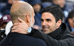 Manchester City manager Pep Guardiola (left) is going head to head with Arsenal's Mikel Arteta for the Premier League title