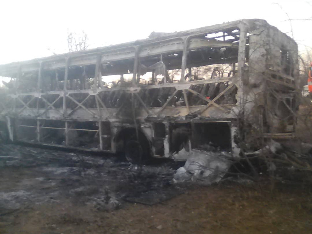 The burnt-out remains of a passenger bus that caught fire are seen near Beitbridge, Zimbabwe. The burnt-out remains of a passenger bus that caught fire are seen near Beitbridge, Zimbabwe.