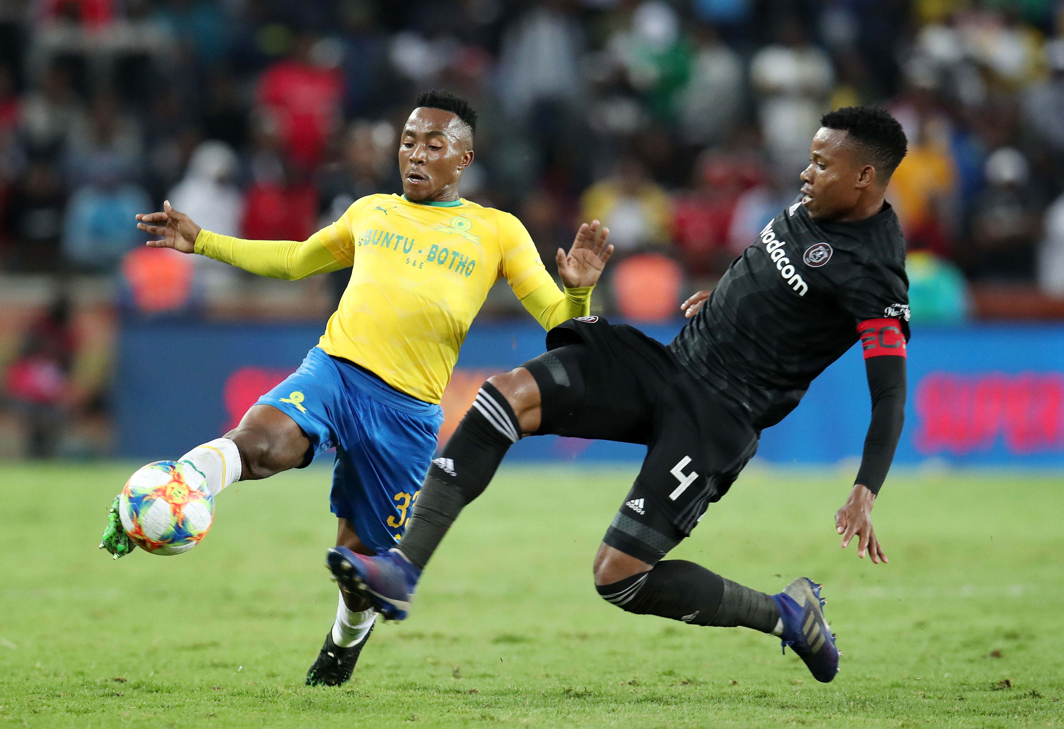 Lebohang Maboe of Mamelodi Sundowns tackled by Happy Jele of Orlando Pirates during the Absa Premiership 2018/19 match between Orlando Pirates and Mamelodi Sundowns at the Orlando Stadium, Soweto on the 01 April 2019.