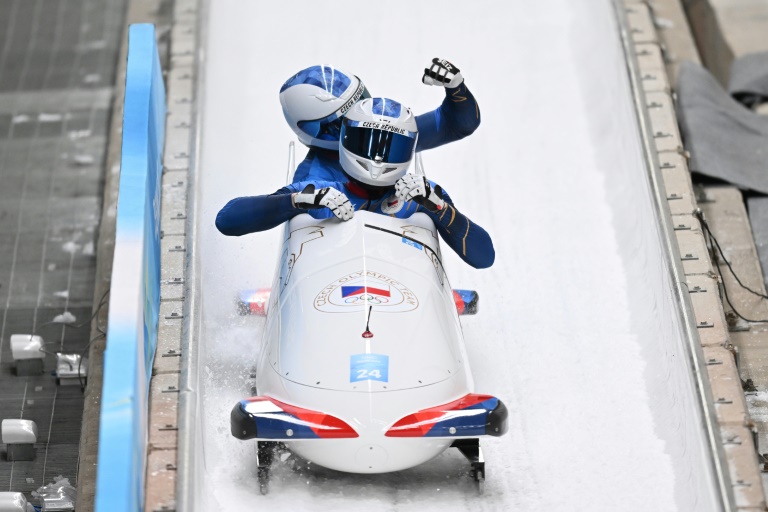 Czech Republic's Dominik Dvorak and Jakub Nosek react at the end of their final run in the two-man bobsleigh