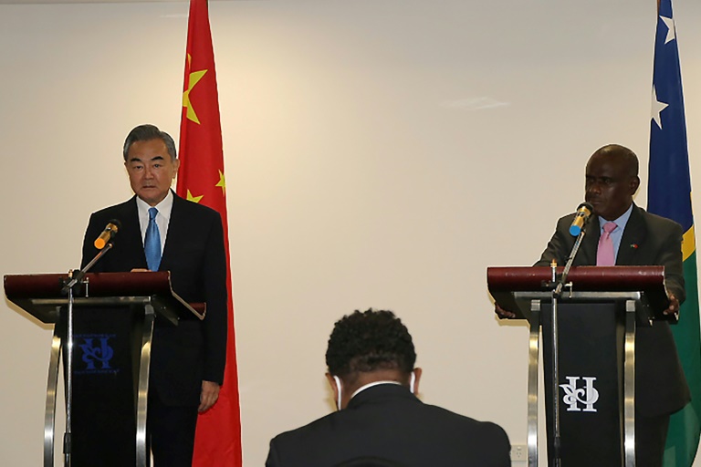 On a tour of the South Pacific, China's Foreign Minister Wang Yi (L) met with Solomon Islands' Jeremiah Manele (R)