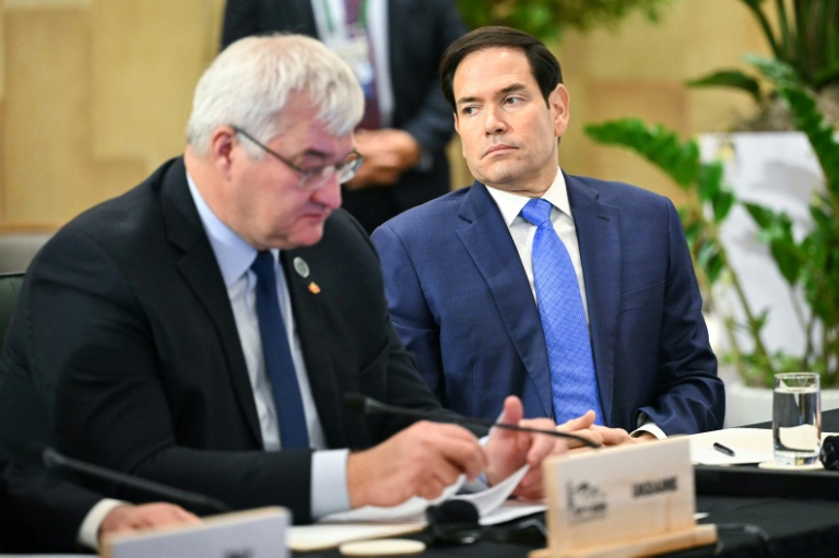 US Secretary of State Marco Rubio sits next to Ukraine's Foreign Minister Andriy Sybiha during a G7 meeting