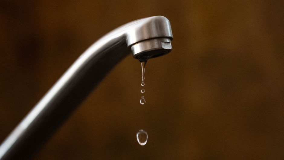 File: Drop of water sinking from a tap.  LOIC VENANCE / AFP