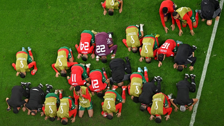 Morocco's players celebrate at the end of the Qatar 2022 World Cup round of 16 football match between Morocco and Spain at the Education City Stadium in Al-Rayyan, west of Doha on December 6, 2022.
