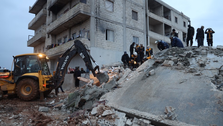 Members of the Syrian civil defence, known as the White Helmets look for casualties under the rubble following an earthquake in the town of Zardana in the countryside of the northwestern Syrian Idlib province, early on February 6, 2023. Mohammed AL-RIFAI / AFP