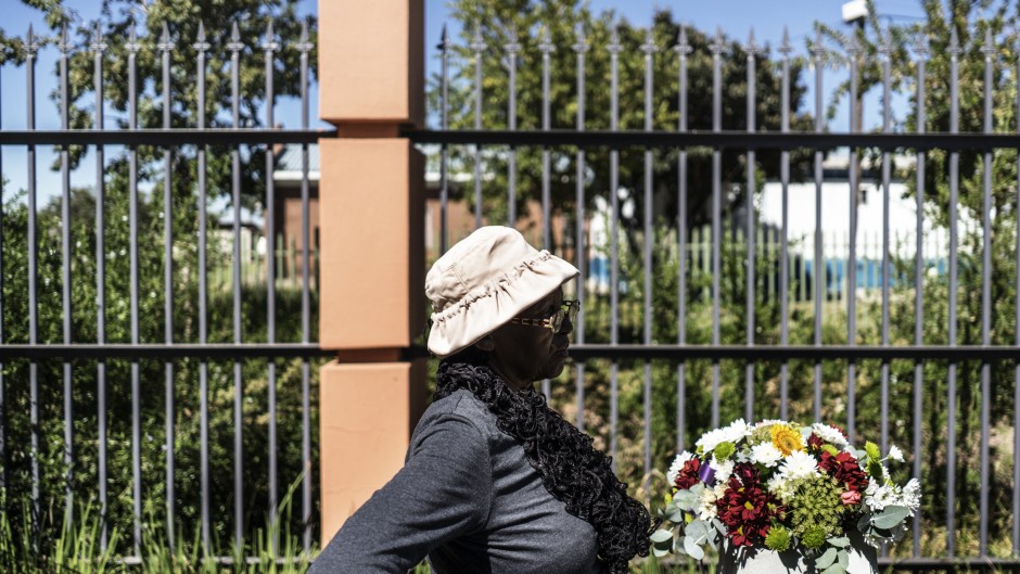 File: A woman pauses at the monument commemorating the victims of the 1960 Sharpeville massacre, in Sharpville. MARCO LONGARI / AFP