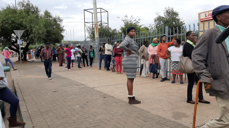 People queueing to receive Sassa social grants.