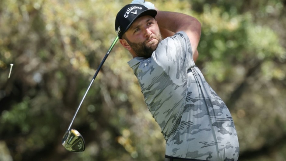 Top-ranked Jon Rahm of Spain lost his match but won his group Friday at the WGC Match Play, advancing to a Saturday knockout showdown against four-time major winner Brooks Koepka