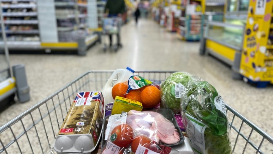 A shopper fills their basket in a Tesco supermarket: scientists have studied the envirnomental impact of 57,000 products sold in supermarkets in Britain and Ireland