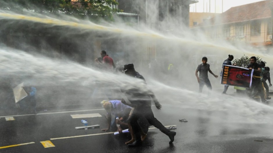 Police use water cannon to disperse demonstrators in Colombo on Tuesday