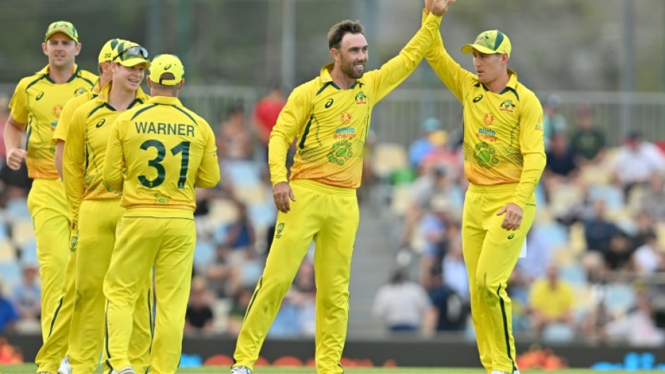 Australia's Glenn Maxwell (2nd R) celebrates his wicket of New Zealand's Kane Williamson