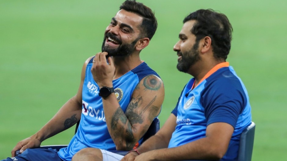 India's Virat Kohli (L) and Rohit Sharma sit for an interview at the end of the Asia Cup Super Four match in Dubai on Thursday