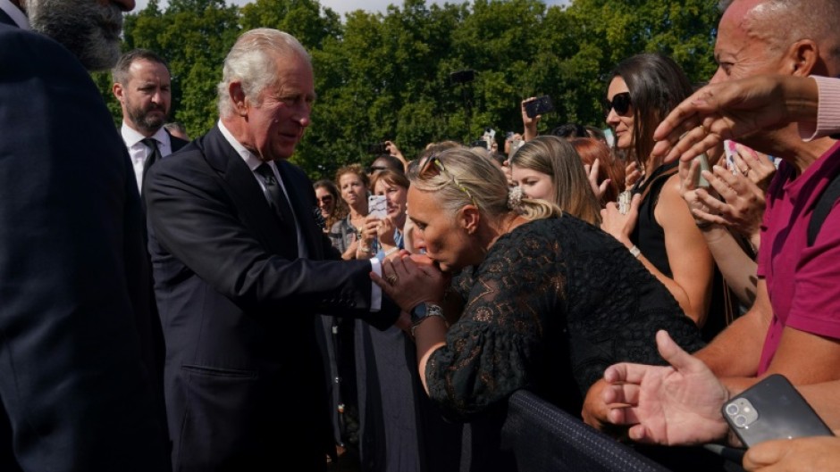 Crowds outside Buckingham Palace shouted 'God Save the King' as he greeted them