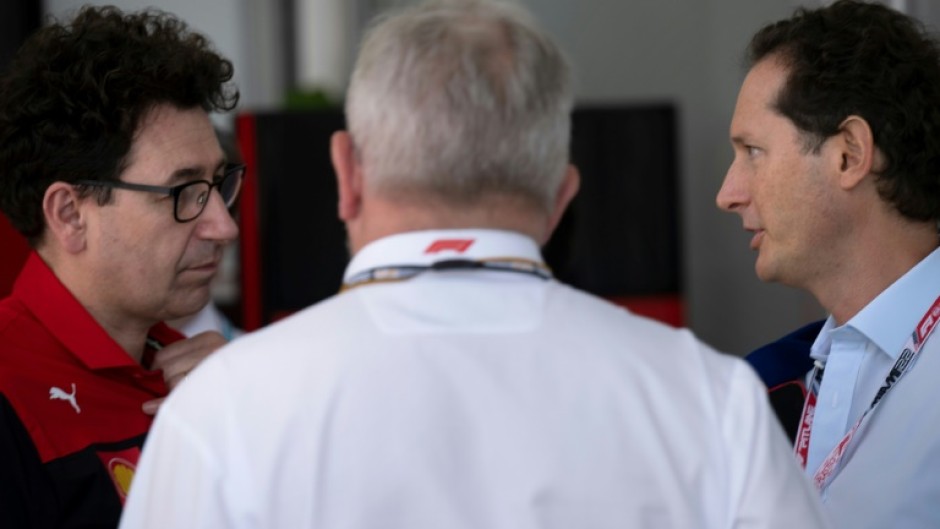 John Elkann (R) says he has faith in Ferrari team principal Mattia Binotto (L) to reconquer the F1 summit