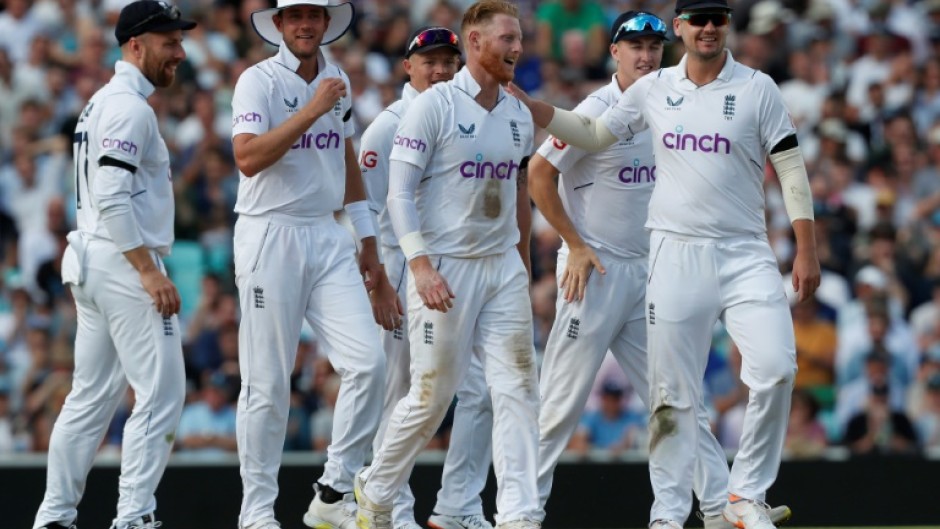 Leading from the front: England captain Ben Stokes (C) celebrates with teammates after he dismissed South Africa's Marco Jansen

