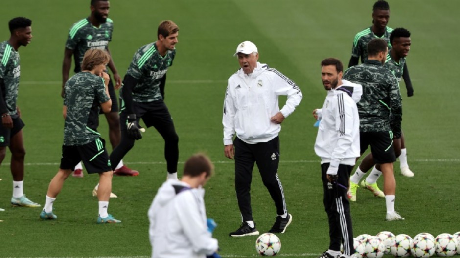 Real Madrid's Italian coach Carlo Ancelotti (C) at training on the eve of their UEFA Champions League match against RB Leipzig