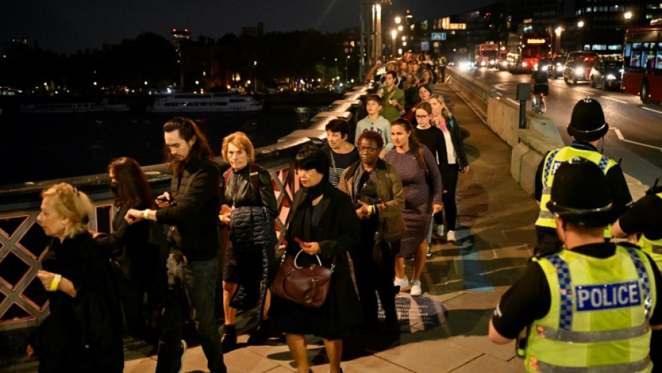 The first public mourners were allowed into the vast medieval Westminster Hall on Wednesday