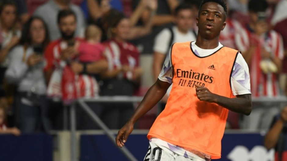 Vinicius Junior warms up in front of Atletico fans 