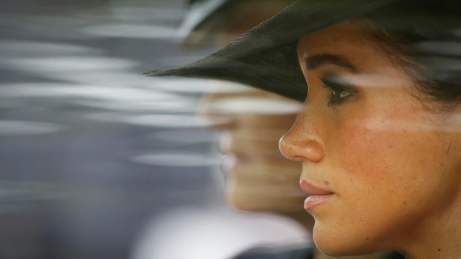 Meghan, Duchess of Sussex, opted for pared back jewellery with a pair of pearl and diamond stud earrings