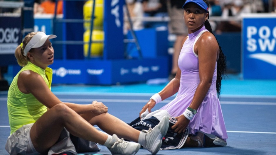 Daria Saville (left) retired from her match with Naomi Osaka (right) at the Pan Pacific Open in Tokyo with a knee injury