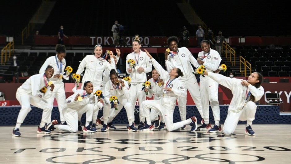 The USA celebrate their gold medals at the Tokyo Olympics. They could begin their bid to win a fourth straight women's basketball World Cup in Sydney with just seven players on court