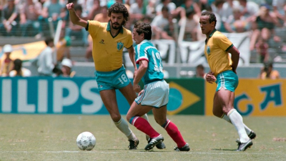 Socrates sidesteps Alain Giresse of France in a World Cup quarterfinal in Mexico in 1986