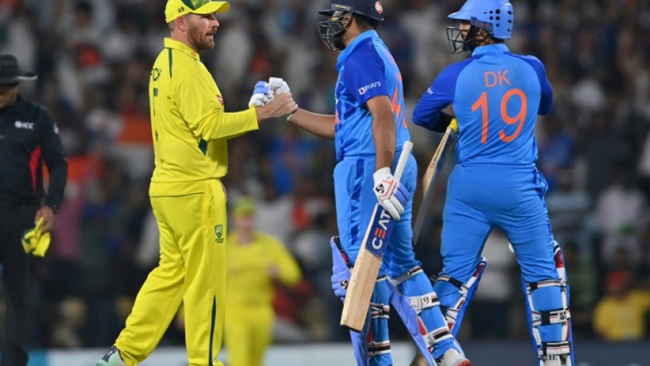 Australian captain Aaron Finch (left) congratulates his Indian counterpart Rohit Sharma 