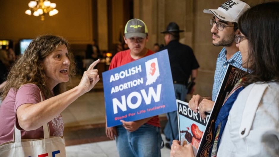 An abortion rights protester shouts at a group of anti-abortion activists in Indianapolis on July 25, 2022 