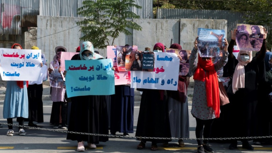 Taliban forces fired shots into the air to disperse a women's rally supporting protests that have erupted in Iran