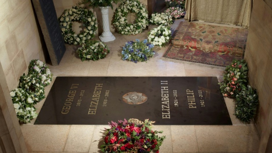 The King George VI Memorial Chapel's marker stone bears the names of the queen, Prince Philip and her parents