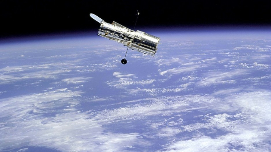 This 1997 NASA file image shows the Hubble Space Telescope as seen from the Space Shuttle Discovery