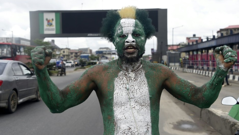 Some carried the green and white flags to mark Nigeria's 62nd independence day