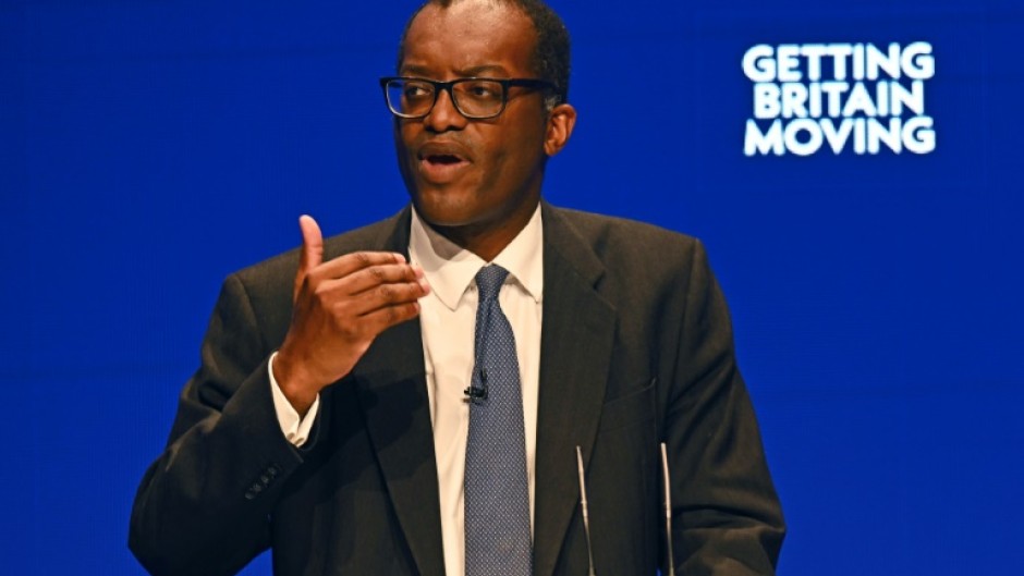 Finance mnister Kwasi Kwarteng's  decision to scrap a controversial plan to cut the top rate of income tax helped lift sterling