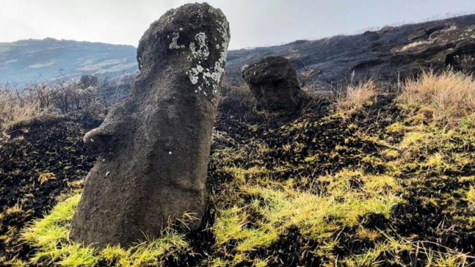 This handout picture released by the Rapa Nui municipality shows moai -- stone statues of the Rapa Nui culture -- affected by a fire at the Rapa Nui National Park on Easter Island, Chile