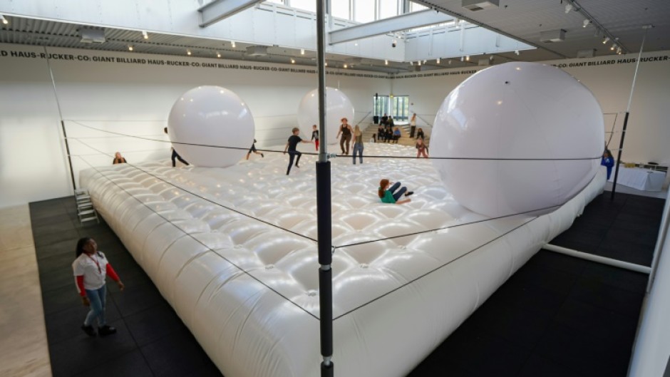 The installation looks like a bouncy game of giant-sized billiards
