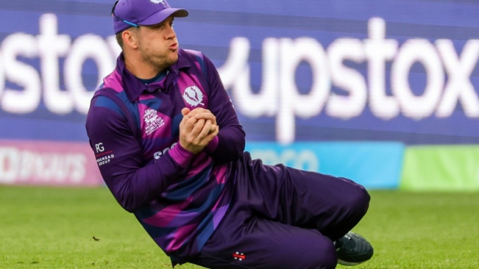 Scotland’s George Munsey takes a catch to dismiss West Indies' batsman Kyle Mayers