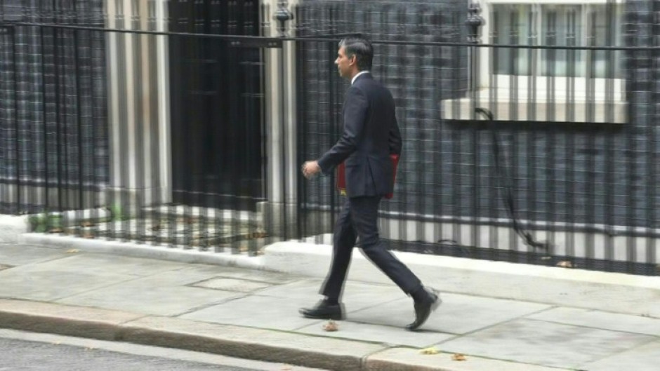 New UK Prime Minister Sunak leaves Downing street to go to Parliament